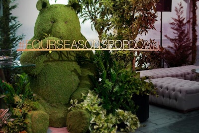 A giant bear topiary welcomed guests into the “secret garden” setting.