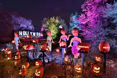 An area inspired by Rodeo Drive in Beverly Hills includes pumpkin-headed shoppers and logos for big-name fashion brands.