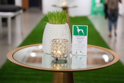 The event served an on-theme cocktail called the Greyhound, consisting of Titos Vodka, grapefruit juice, and a lemon or lime wedge. The cocktail and wine menu was placed next to wheatgrass centerpieces.