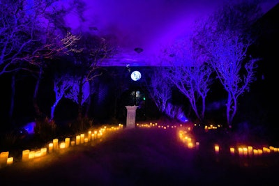 The other path open to visitors was the 'Path of Night,' which included a spooky, candle-lined forest room that evoked Sabrina's 'dark baptism' from the show. On the series, witches sign the 'Book of the Beast' to devote themselves to Satan, whereas at the premiere party, it was used as a guest book.