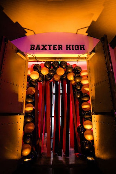 Black, yellow, and orange balloons and streamers added a peppy, but still dark and on-theme, vibe to the high school-inspired space.