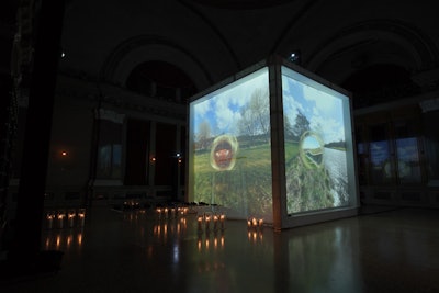 The Macallan Distillery Experience was housed in a 15-foot cube structure that featured 360-degree video projections of Scottish scenery and the distillery. The video was captured by drones and a remote-controlled robot.