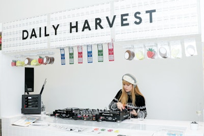 The DJ booth was styled like a cashier counter, complete with faux lottery tickets.