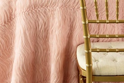 Blush tulle wave tablecloth, table runner, and pillow, $15 to $85, available globally from Nuage Designs