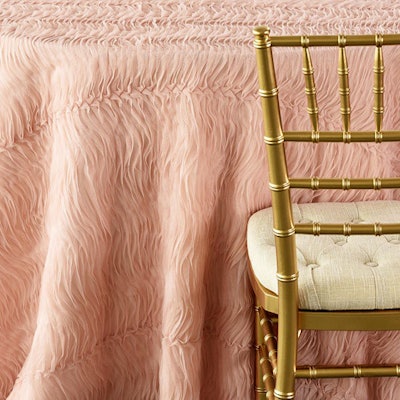 Blush tulle wave tablecloth, table runner, and pillow, $15 to $85, available globally from Nuage Designs
