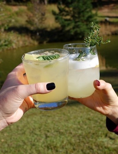 Bold Catering & Design in Atlanta created two drinks for a recent outdoor fall event. The Mule on the Farm (pictured left) has Lass and Lions vodka, fresh lime juice, ginger syrup, ginger beer, and mint. Grand Pappy’s Gin Joint (pictured right) has John Emerald Distillery gin, fresh lemon juice, egg white, and simple syrup.