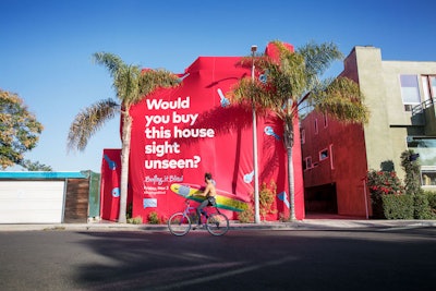 To promote its new reality series Buying Blind, which premieres tonight and follows six couples who buy houses without actually seeing them, Bravo created a series of eye-catching stunts in Los Angeles (pictured), Chicago, and New York. Three existing homes in high-traffic areas were covered in colorful packaging that asked, “Would you buy this house sight unseen?” The wrapped houses, which are actually on sale, were also advertised on Zillow and Trulia. 360i and the Bait Shoppe worked on the promotion.