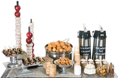 The “Take the Chill Off Cart” from Abigail Kirsch Catering in New York features rich hot cocoa and warm caramel-cranberry cider along with toppings, bite-size caramel apples, and warm cinnamon sugar doughnut holes.