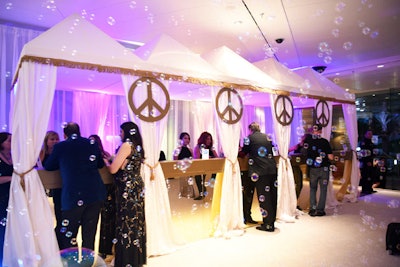 The check-in area was housed in a white tent decorated with gold peace signs.