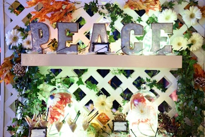 One catering station was decorated with a variety of flowers and greenery, along with industrial-style letters that spelled “peace.”