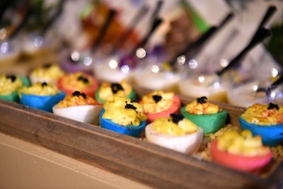 Deviled eggs resembling colorful flowers were served to guests.