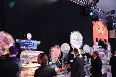 Other ice sculptures displayed on-theme illustrations and the name of the event.