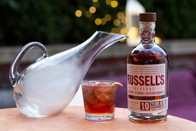 Bourbon brand Russell’s Reserve is promoting a number of cocktails for cold weather, including the Smokin’ Russell’s, which has bourbon, vermouth, hibiscus syrup, plum bitters, cherry smoke, and a lemon twist. The cocktail is smoked with a choice of woods including apple wood, cherry wood, and mesquite barbecue wood.