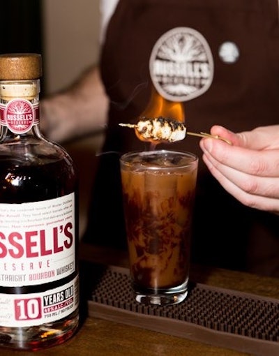 For a slightly sweeter cocktail, Russell’s Reserve’s Kentucky Campfire is made with bourbon, chocolate syrup, and orange bitters. The drink is topped off with soda and torched mini marshmallows.