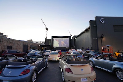 Volkswagen hosted its annual drive-in event on November 30 at Goya Studios. Designed to honor the final edition of the Volkswagen Beetle, the event displayed historic versions of the compact car and offered a photo booth inside a VW Bus. Later, guests climbed into provided cars for a screening of Herbie Fully Loaded. The event drew attendees including Vanessa Hudgens and Austin Butler, and was produced by Gail & Rice.