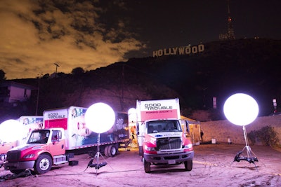Freeform's Good Trouble dining experience took place in an open-air space below the Hollywood sign. The iconic location was chosen to reflect the excitement the main characters feel after moving to Los Angeles.
