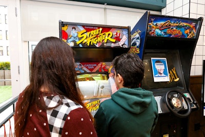 Members could also play old-school arcade games.
