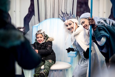 In the entertainment tent, guests can have their photo taken with elves who are part of the festival's fantasy world.