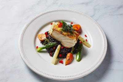 Guests will then choose between two entrees. The first is Chilean sea bass with forbidden black rice, green asparagus, globe carrots, crispy herb leaves, and sweet pepper concasse.
