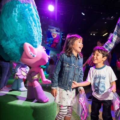 Guests can enter the hair-raising world of the DreamWorks Trolls through this interactive experience from Feld Entertainment, in partnership with Universal Brand Development. Centered around “Poppy’s Best Day Ever Celebration,” visitors are guided by a rainbow path, making stops along the way at the Hair We Go Salon for a makeover and at Branch’s Musical Mashup to create custom beats before ending up at a 3-D dance party. Guests also create a photo scrapbook. The ticket price (starting at $30) includes Trolls collectables, makeover accessories, temporary tattoos, 3-D glasses, a keepsake starter scrapbook, and a printed photo. Plus, guests can grab sweets made by City Bakery from the on-site Cupcakes & Rainbows cafe. DreamWorks Trolls The Experience is open through May 12, 2019. Birthday parties and group outings can also be booked in the private party room. A $5 discount per ticket (weekdays only) for groups of 15 or more is available by booking with the Trolls concierge team.