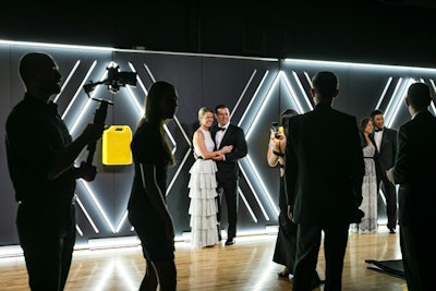 The event's entrance juxtaposed Jerry cans—containers for carrying liquid that are also Charity: Water's symbol—with futuristic neon details.