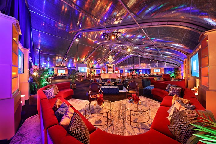 Eclectic pillows and rugs added to the large tent&apos;s warm, intimate vibe. Additional vendors included OM Digital for the photo booth, DJ Alex Merrell for entertainment, and Cafe Luxxe as the coffee partner.