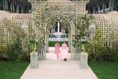 The episode also chronicled the construction of the show's set design, which featured a giant garden trellis structure in the middle of Le Grand Palais.