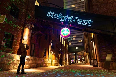 The third edition of the Toronto Light Festival runs through March 3 at the Distillery Historic District. A neon hashtag sign welcomes guests to the event, as does a disco ball that surrounds guests in colorful lights.