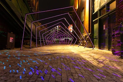 Penta-Or, or “Five Lights” is a geometric installation made of 11 metal arches and more than 75 meters of LED lights. The installation was created by ENA, an Israel-based visual arts group made up of three art festival fans.