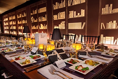 Bulgari's 2011 fund-raiser for Save the Children and Artists For Peace and Justice used real books—and graphic versions—to create a lavish library look at Ron Burkle's private Los Angeles manse. Sketched fabrics on the tent walls imitated library shelves, while children's books redone with white book jackets served as centerpieces for the tables.