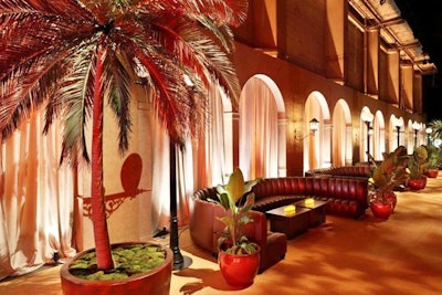 Twenty-foot palm trees created a tropical vibe, and arches were painted to look like they were from the 1920s.