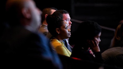 HSBC employee listens to executives speak about the future of the company in the US