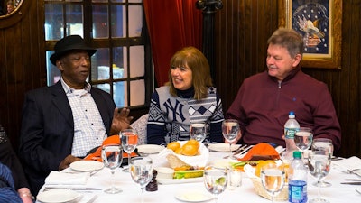 World Series champion Yankees great Mickey Rivers engages tour guests during a dinner Rivers hosted