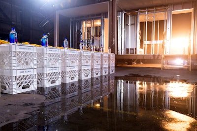 Prior to the official Lexus UX reveal, guests took in the John Elliott Fall 2019 show at the Brooklyn Navy Yard from their seats on custom-branded milk crates. Each seat bore a special T-shirt commemorating the season while the runway had a distinctly vacant and warehouse-like feel. Directly adjacent, the after-party DJ was housed inside a modular home by Full Stock Modular, whose warehouse the event occupied.
