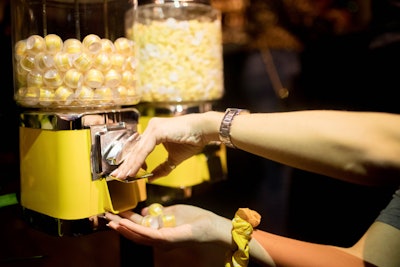 The event featured yellow candy machines that dispensed conversation starters for guests.