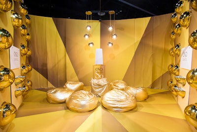 A gold-color “Care & Condition” room highlighted the brand’s SolarOil product, which is applied over nail polish. The room featured gold bean bags and lighting fixtures.