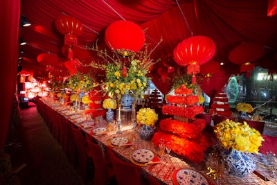 Eddie Zaratsian created lush red and yellow floral designs inside the dinner tent.