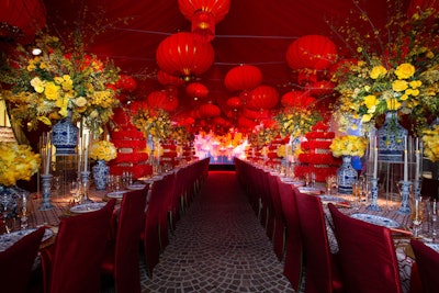 Dinner, which was catered by Wolfgang Puck's Chinois on Main restaurant, was served in a colorful tent filled with eye-catching red, gold, and yellow decor by Aliana Events.