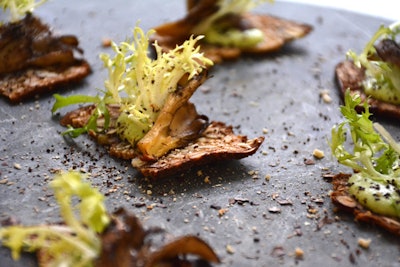 Mushroom toast with house-made truffled coffee oil from recycled grounds and garnished with fresh toasted coffee grounds, by Drake Catering in Toronto