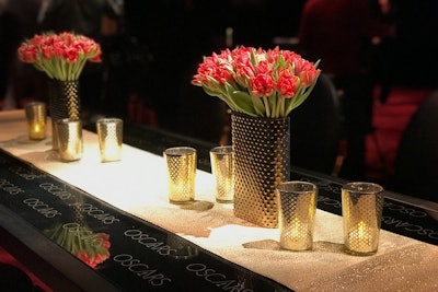 Textured gold vases and candles will add a sleek, upscale vibe to the ballroom.