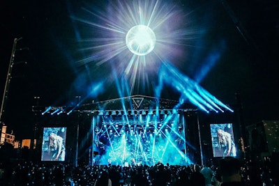 Hoisted by a construction crane, a disco ball served as a focal point of the Mind Melt stage.