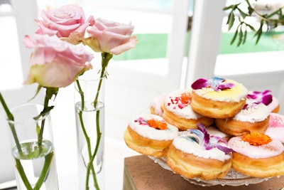 The floral design was also evoked on the table itself, where Donut Princess LA created doughnuts covered in flower petals.
