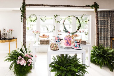 The design continued to the dessert table, which Luca noted was her favorite aspect of the event. A variety of eye-catching sweets were framed by birch, greenery, and flowers.