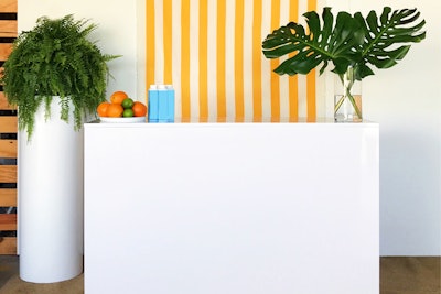 Miami-based Ronen Rental recently released its Stella Gloss Bar ($395) with a gloss finish and clean, simple lines. It features an open back with a five-and-a-half-foot shelf. Plus, the unadorned surface can easily be branded with a company logo. It also comes in black and is available for rent in Florida.