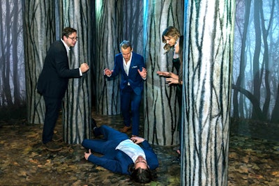The event featured a faux forest where guests could pose in crime scene photo ops.