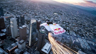 Members of the Red Bull Air Force wore branded, LED-equippred wingsuits while jumping from a helicopter 4,000 feet in the air.