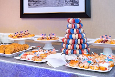 To go with the screening's 'over-the-top Americana' theme, a dessert buffet included a red, white, and blue macaron tower, mini pies topped with American flags, chocolate chip cookies, and a selection of mini-doughnuts that Astro Doughnut had developed for the recent election season.