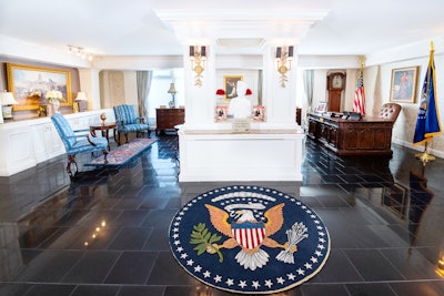 The entrance to the faux Oval Office includes the presidential seal. Terri Jannes Interiors designed the suite and Oval Office using original Veep pieces from HBO.