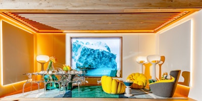 David Scott Interiors and Roche Bobois created a dining experience reminiscent of that aboard a luxury liner cruising the Atlantic. The seating area included ocean blue and warm sunshine yellow hues, and the curvy chairs and vases in the dining area evoked undulating waves.