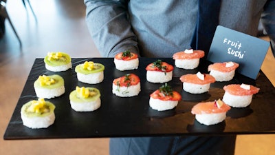 Blue Plate Catering in Chicago offers fruit “sushi,” with a sweet coconut rice base topped with fresh fruit. Fruit options include kiwi and mango, strawberry with basil, and grapefruit, pomegranate, and coconut chip.